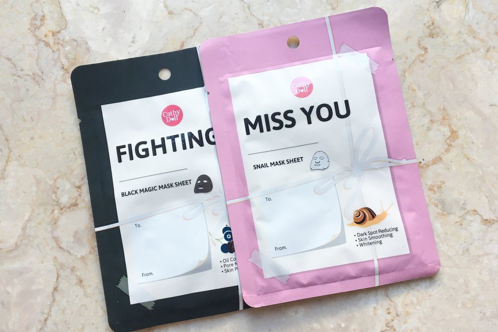 Тканевая маска для лица из Таиланда с водорослями, черным кунжутом и углем Cathy Doll Fighting Black Magic Mask Sheet 25 гр. Тайская маска Watsons+Sheet+Mask